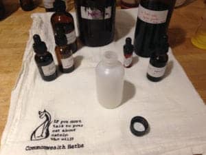 Ingredients for the herbal joint liniment in their bottles.